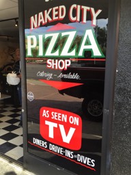 Out front of Naked City Pizza
