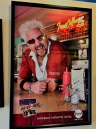 Triple D Poster hanging at Tortilla Cafe