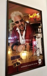 Triple D poster up at The Bagel Deli
