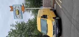 Street Sign & Cornbread Café Van