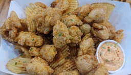 Trying the Gator Bites at May Moes Cajun Grill