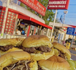 a look outside with a plate of burgers
