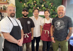our team taking a picture with guy fieri