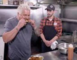 guy fieri trying the wings