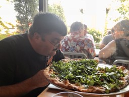 Bill Grella loving the pizza